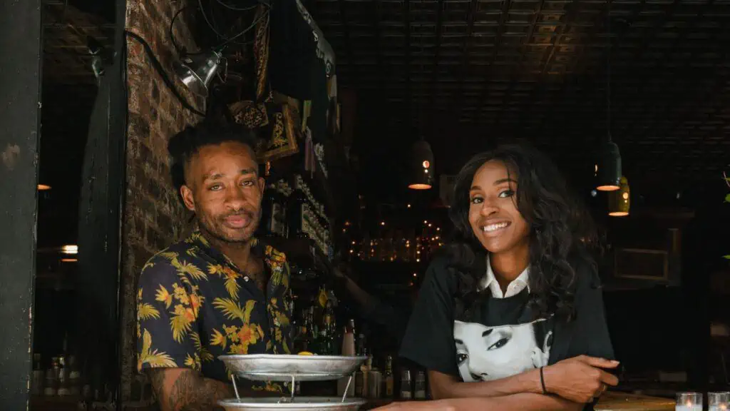 Two Black entrepreneurs promoting their businesses on The BLACQList black-owned business directory